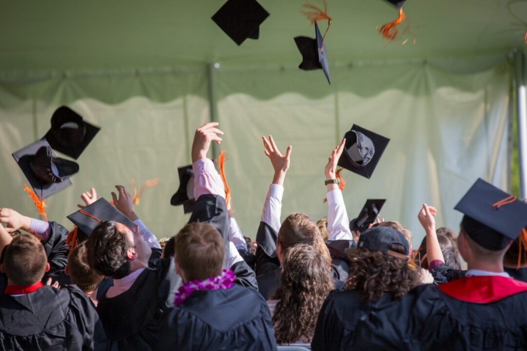 Graduating Class Wearing Cap and Gown and Stole